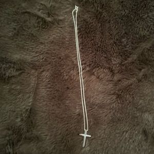 Tiffany’s silver cross necklace with diamond center only on app communication